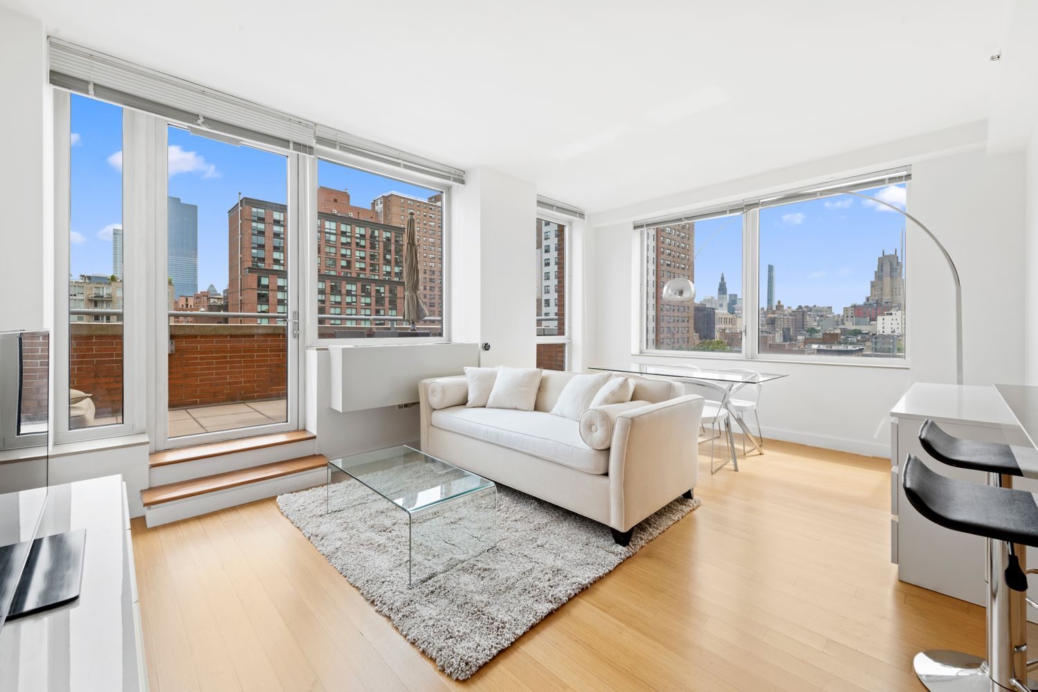 Living room with glass doors to a terrace at 450 West 17th Street in Chelsea